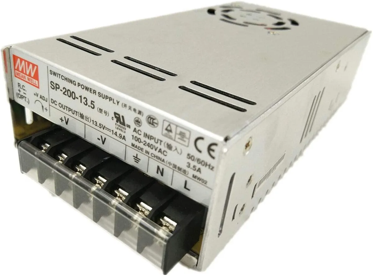 Rectangular metal power supply unit with built-in fan, silver-grey finish, label showing 13.5V 14.9A 200W