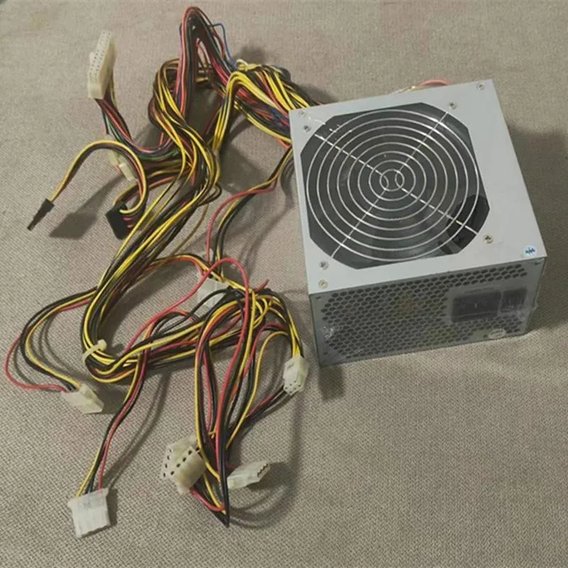 Rectangular ATX power supply unit with matte black metal casing and rear cooling fan grille