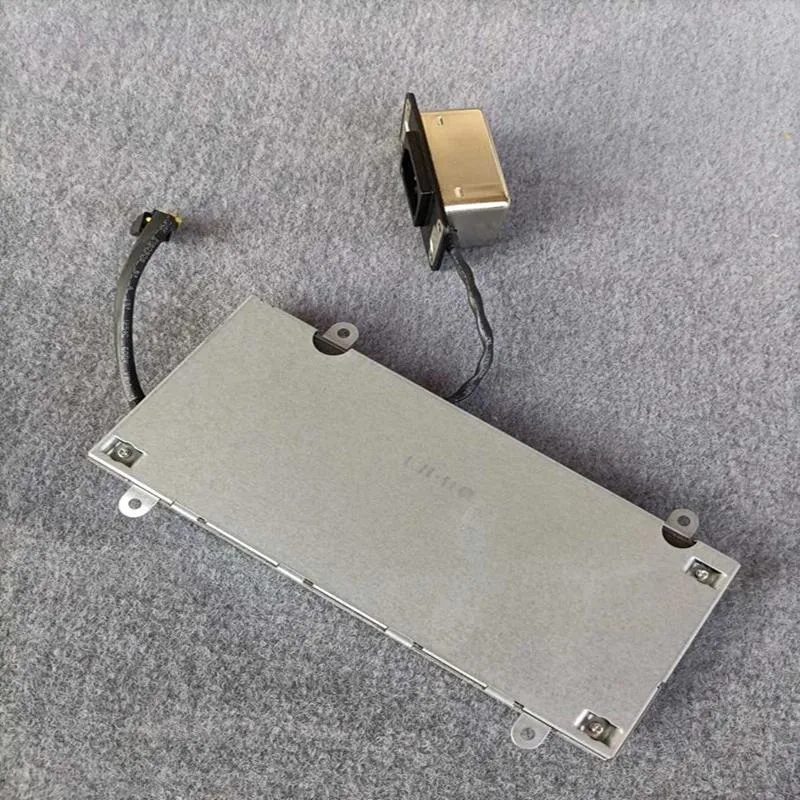 Rectangular silver ATX power supply unit with fan grille visible