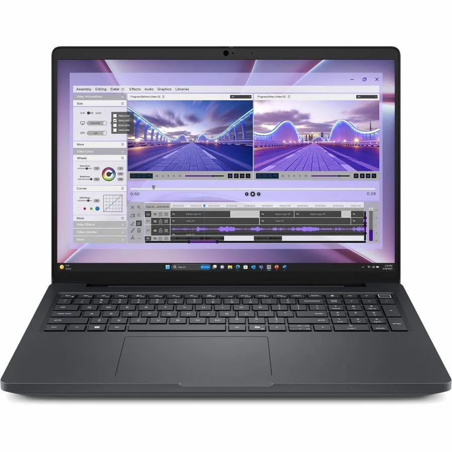Silver 16 inch laptop closed on a plain surface, thin profile, Dell logo on lid