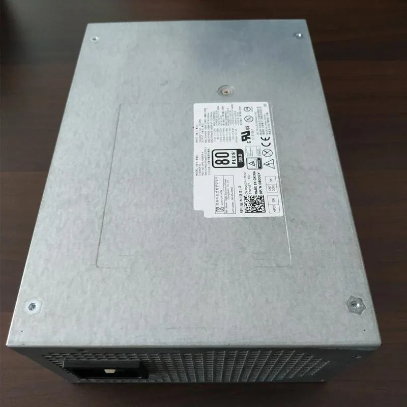 Rectangular silver ATX power supply unit with black cooling fan and modular cable sockets