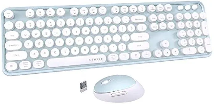 Full-size wireless keyboard with green and white round keycaps on a reflective base