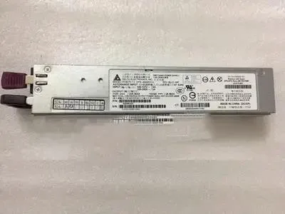 Rectangular silver server power supply unit with rear exhaust grille and label showing part numbers