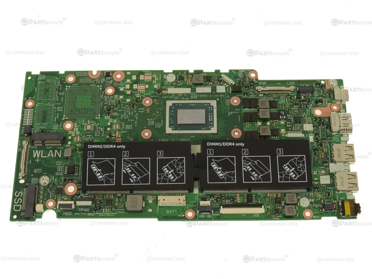 Green rectangular laptop motherboard with silver heatsink and black components