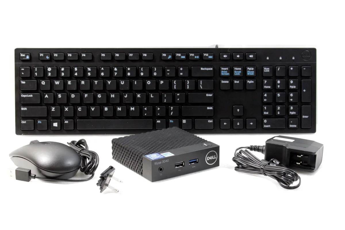 Small black rectangular thin client unit with front USB ports and rear display ports
