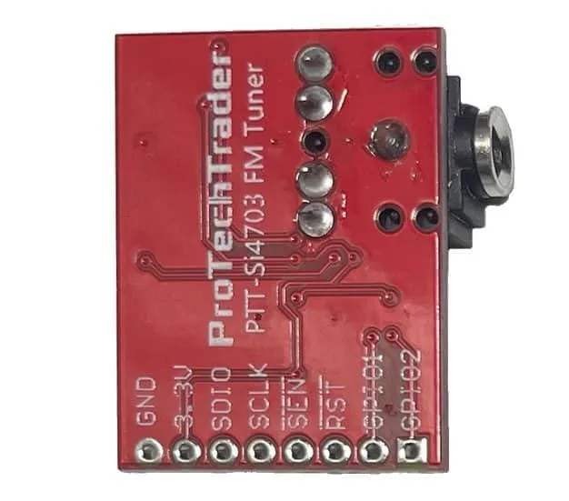Small green circuit board with 3.5mm audio jack and pin headers