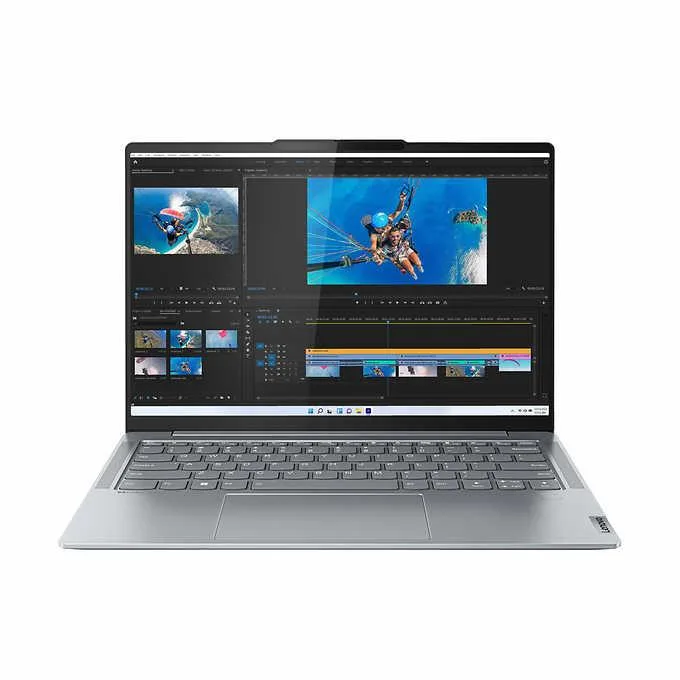 Slim silver 14 inch touchscreen laptop with backlit keyboard and thin bezels