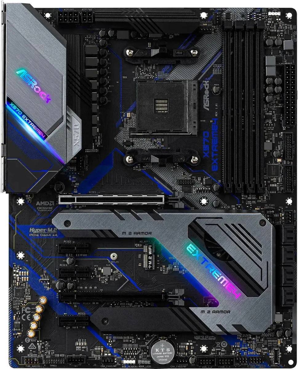 Rectangular ATX motherboard, dark PCB, silver heatsinks, AM4 socket, four DDR4 slots, multiple PCIe slots, M.2 covers, rear I/O shield
