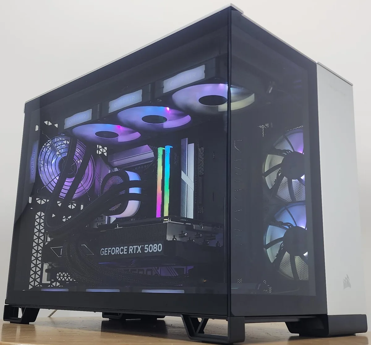 Black and silver mid-tower case with visible RGB liquid cooler and graphics card