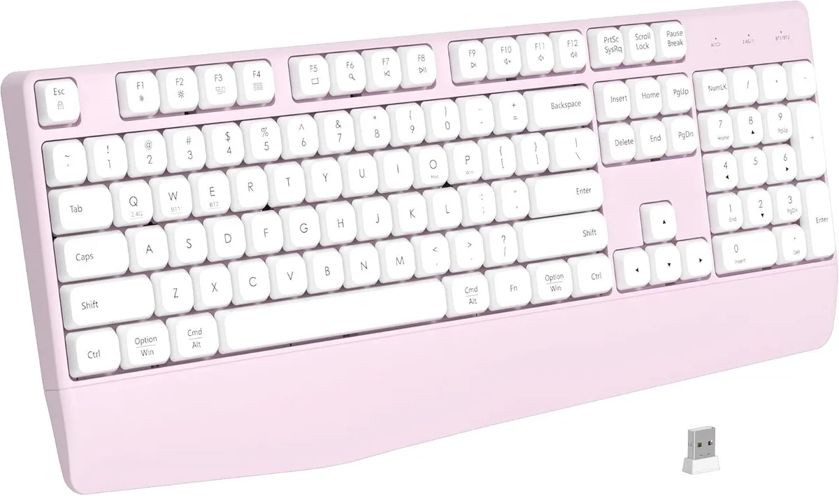 Pink full-size wireless keyboard with integrated wrist rest