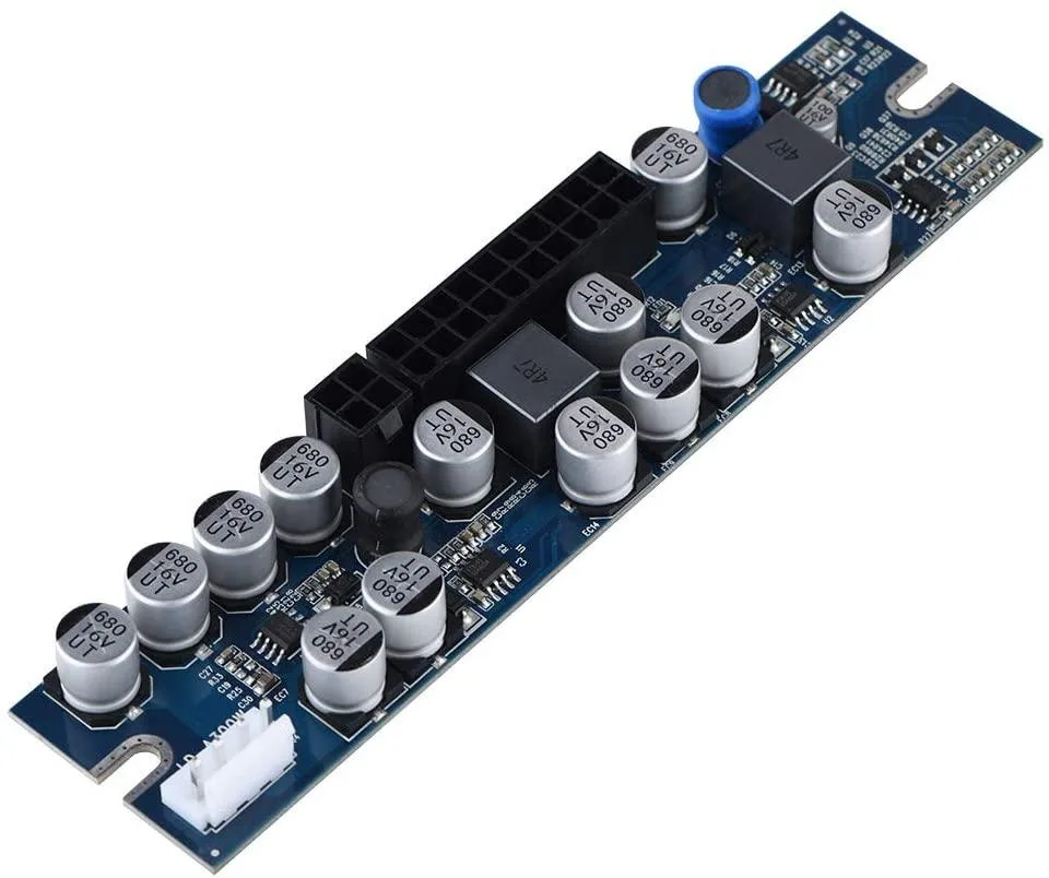 Compact black power module with 24-pin ATX cable and DC input lead, 154 by 35 by 15 mm