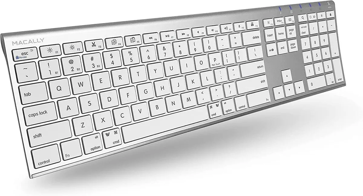 Silver full-size keyboard with 110 round keys and matching mouse