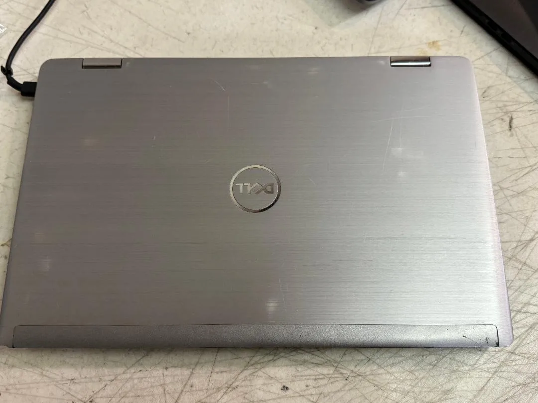 Silver Dell Latitude 7420 2-in-1 laptop, 14-inch touchscreen, backlit keyboard, webcam, AC adapter included