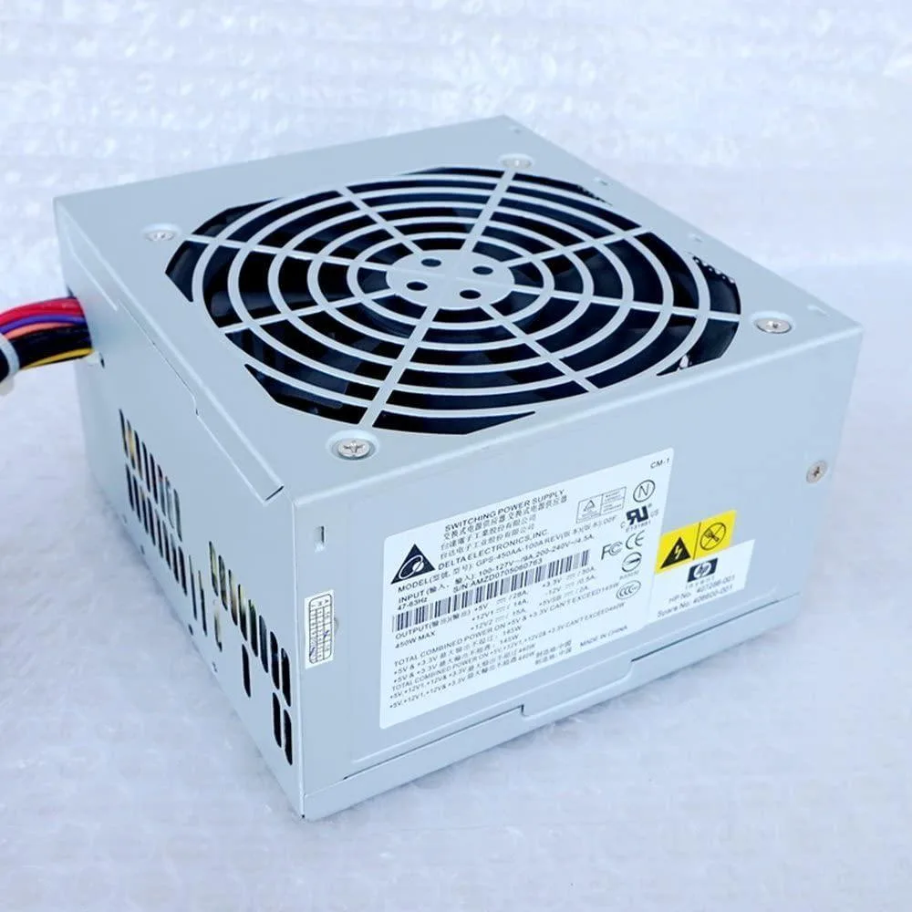 Rectangular AT power supply unit in metal casing with ventilation grille and power connectors