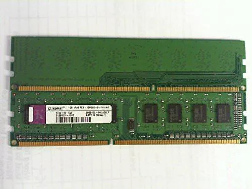 Green printed circuit board with black memory chips and gold edge connectors