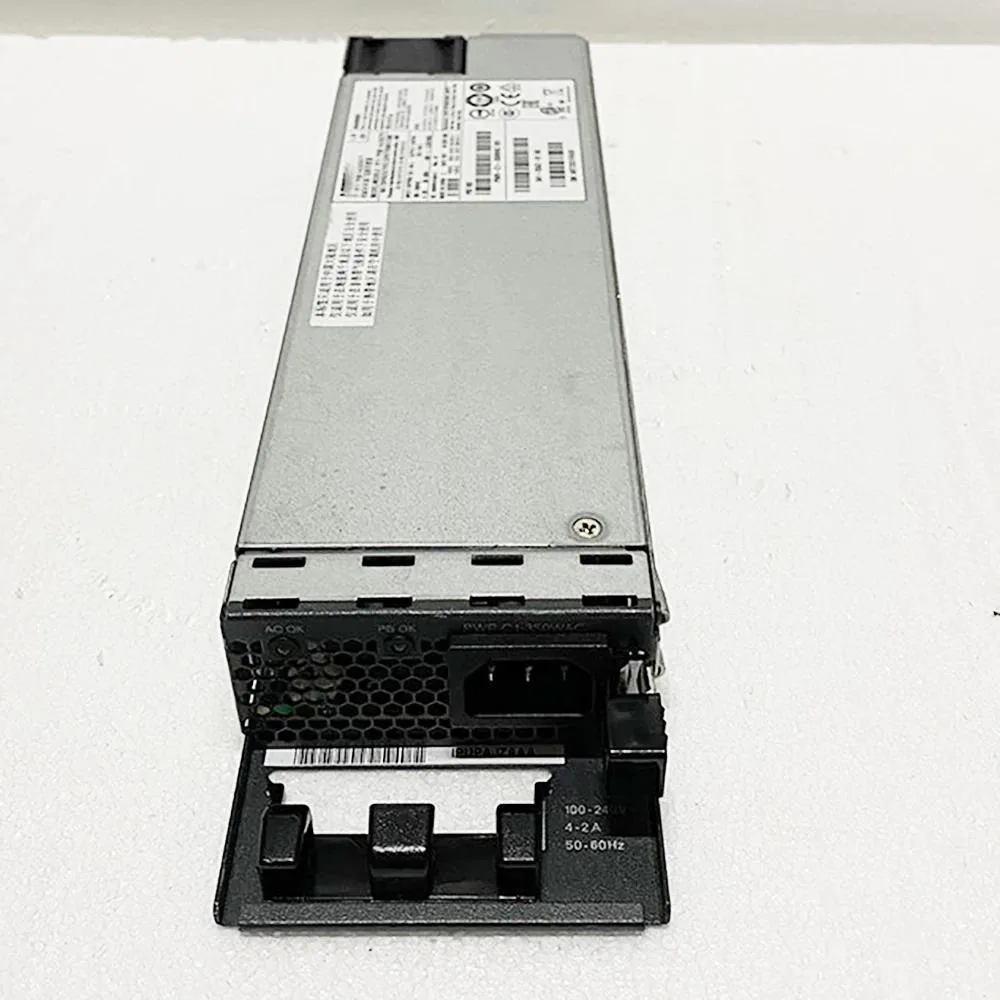 Rectangular silver metal power supply unit with ventilation grille and label showing model numbers