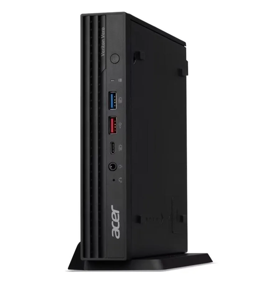 Compact grey tower desktop with wired keyboard and mouse