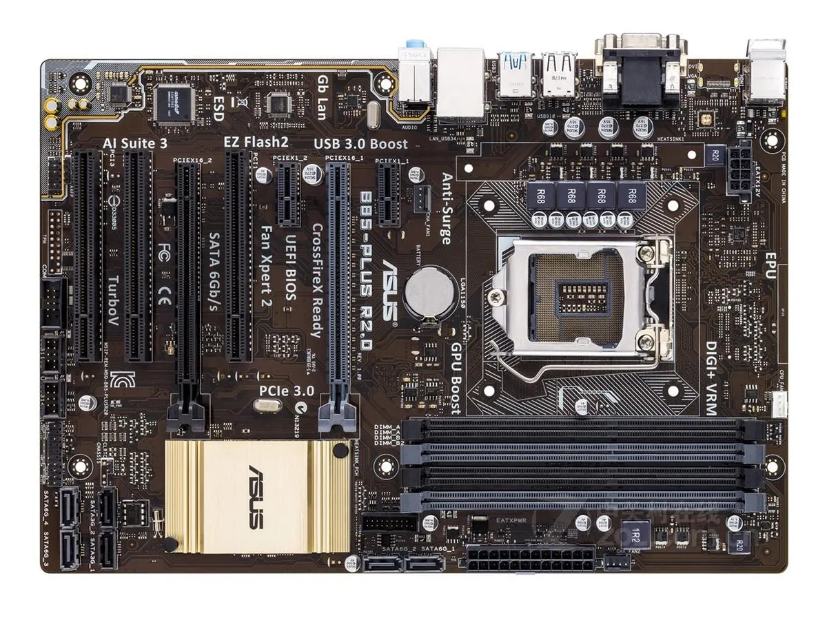 ASUS B85-PLUS R2.0 ATX motherboard, black PCB with silver heatsinks and blue DDR3 slots