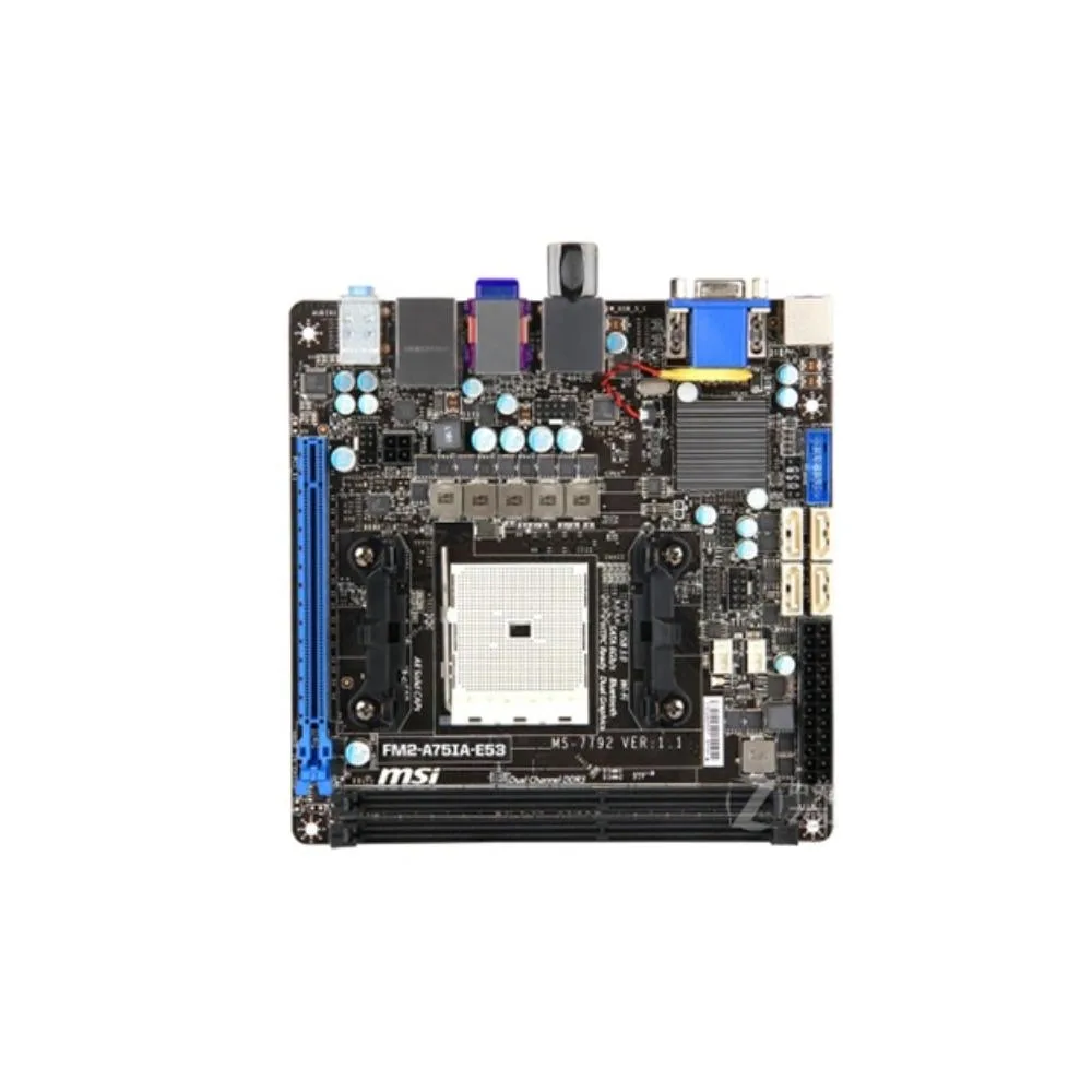 Compact Mini-ITX motherboard in dark tones with FM2 socket, DDR3 slots, PCIe x16 slot, SATA ports, rear I/O panel and heatsinks