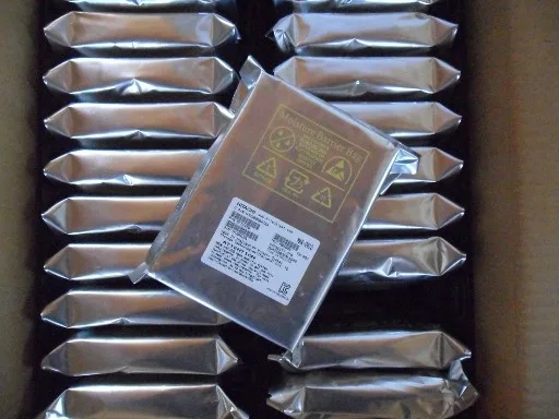Silver rectangular 3.5 inch internal hard drive with circuit board visible underneath
