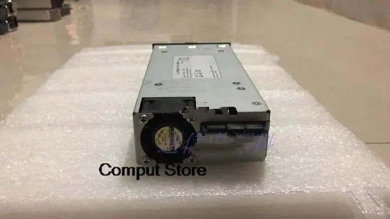Silver rectangular ATX power supply unit with label showing model numbers