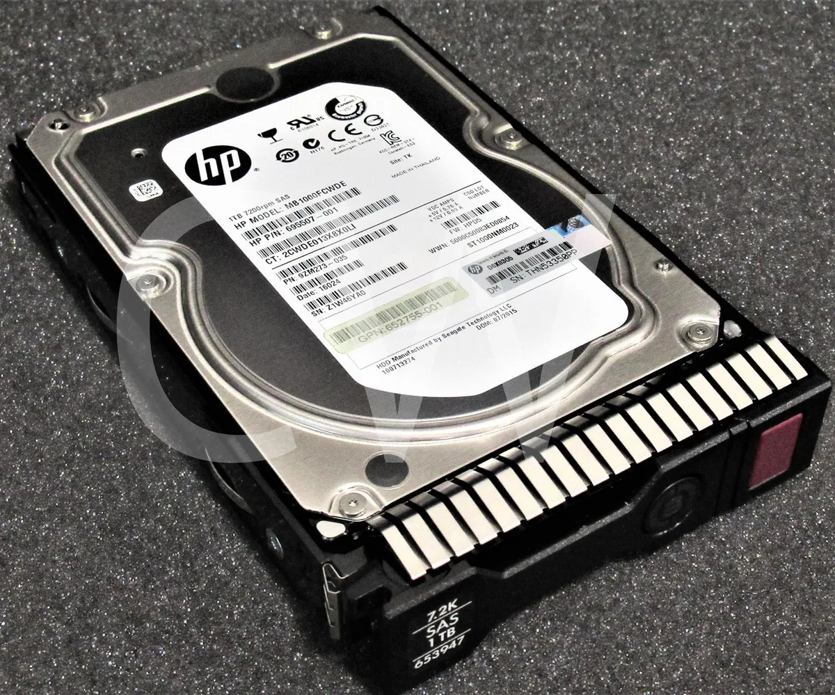 3.5 inch SAS hard drive in silver metal caddy with green handle