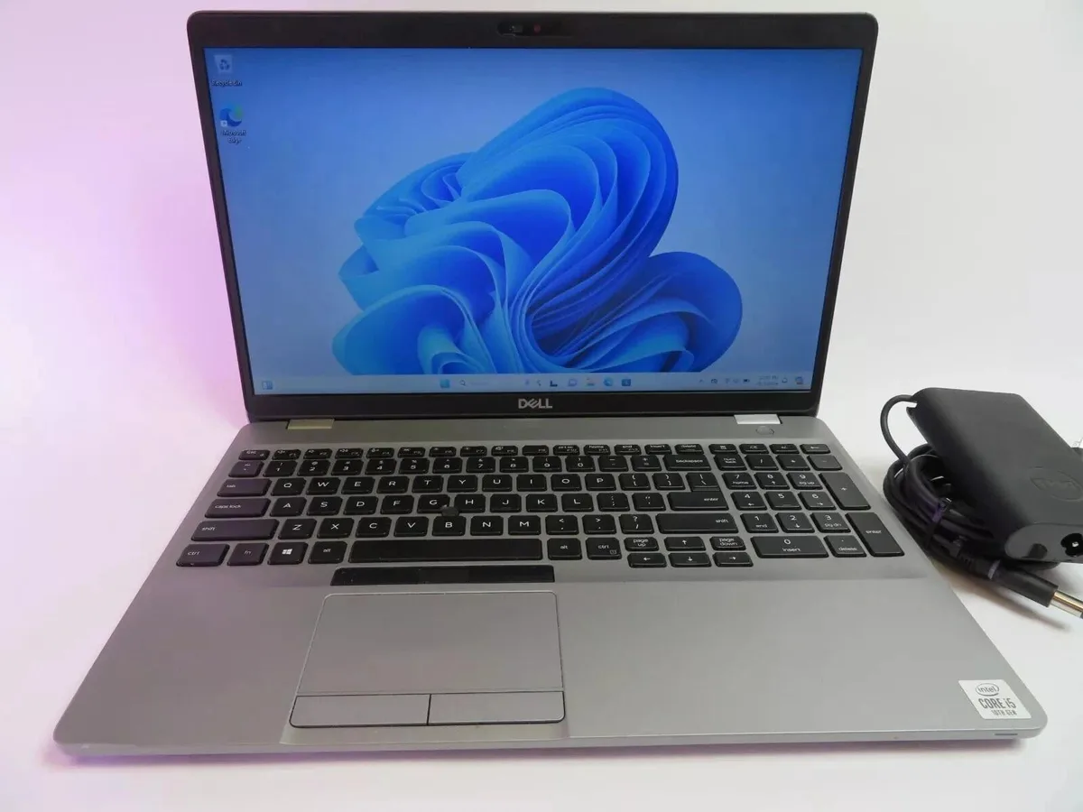 Silver Dell Latitude 5510 clamshell laptop closed on a plain background