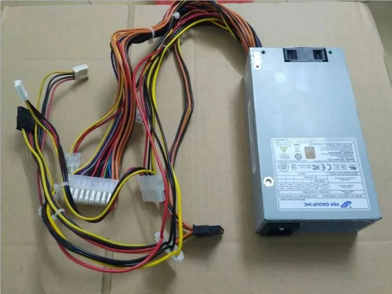 Compact silver 1U ATX power supply unit with rear fan grille and power socket