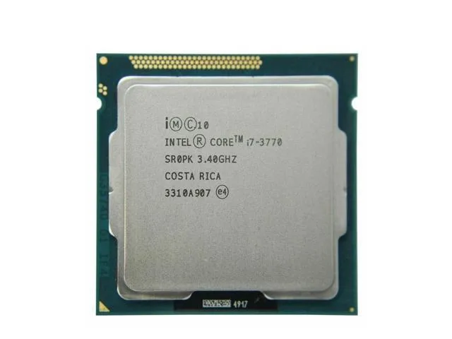 Square green CPU die on a rectangular green substrate with gold LGA 1155 contacts