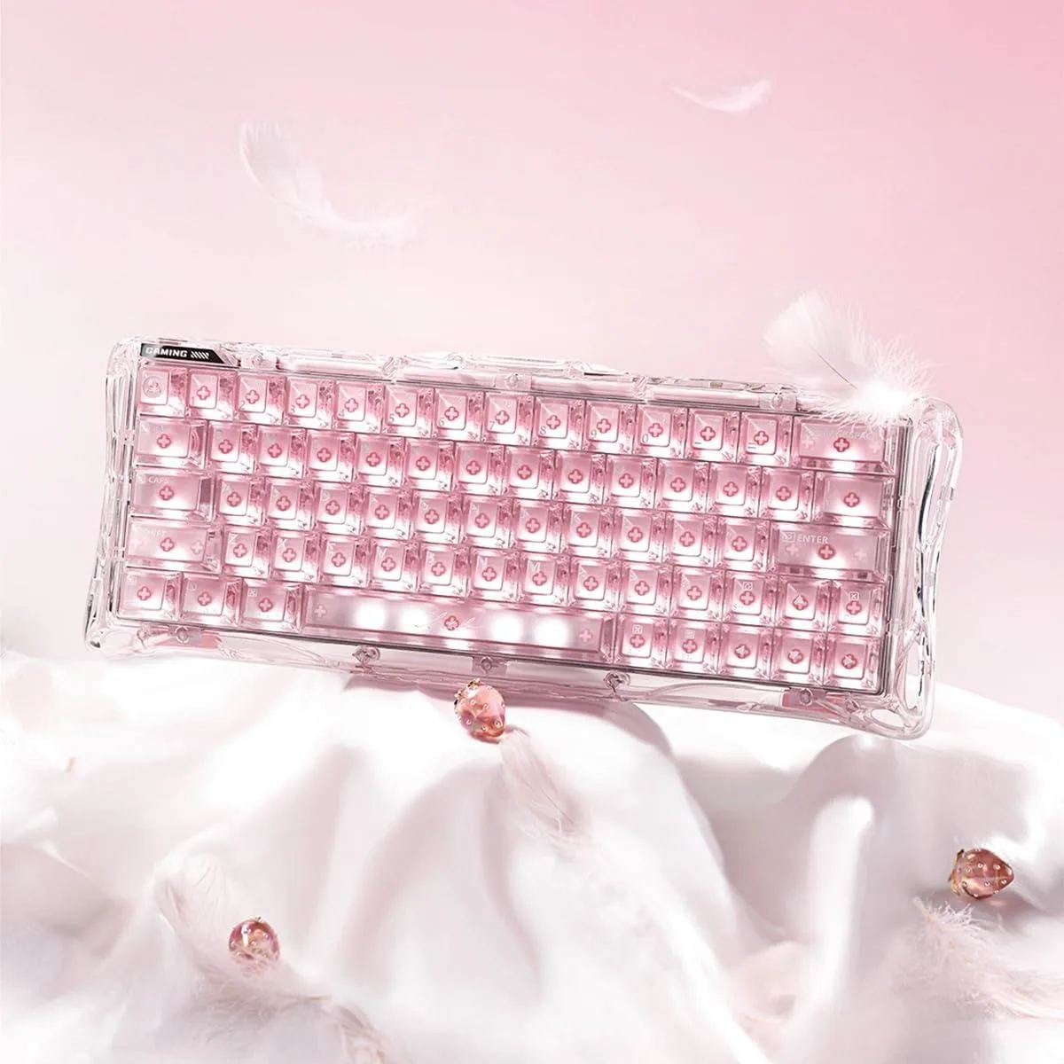 Pink compact gaming keyboard with transparent case and RGB lighting