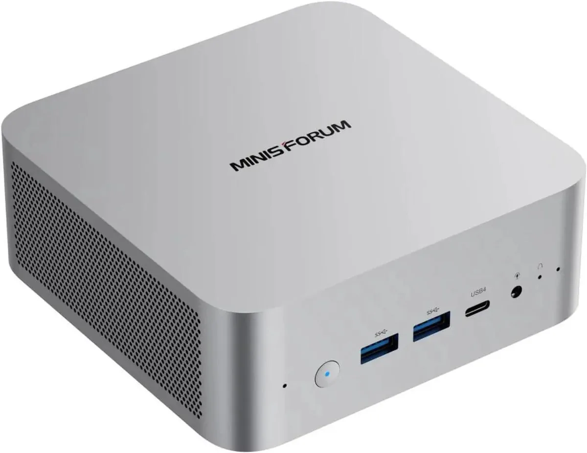 Silver compact barebone mini PC with front ports visible