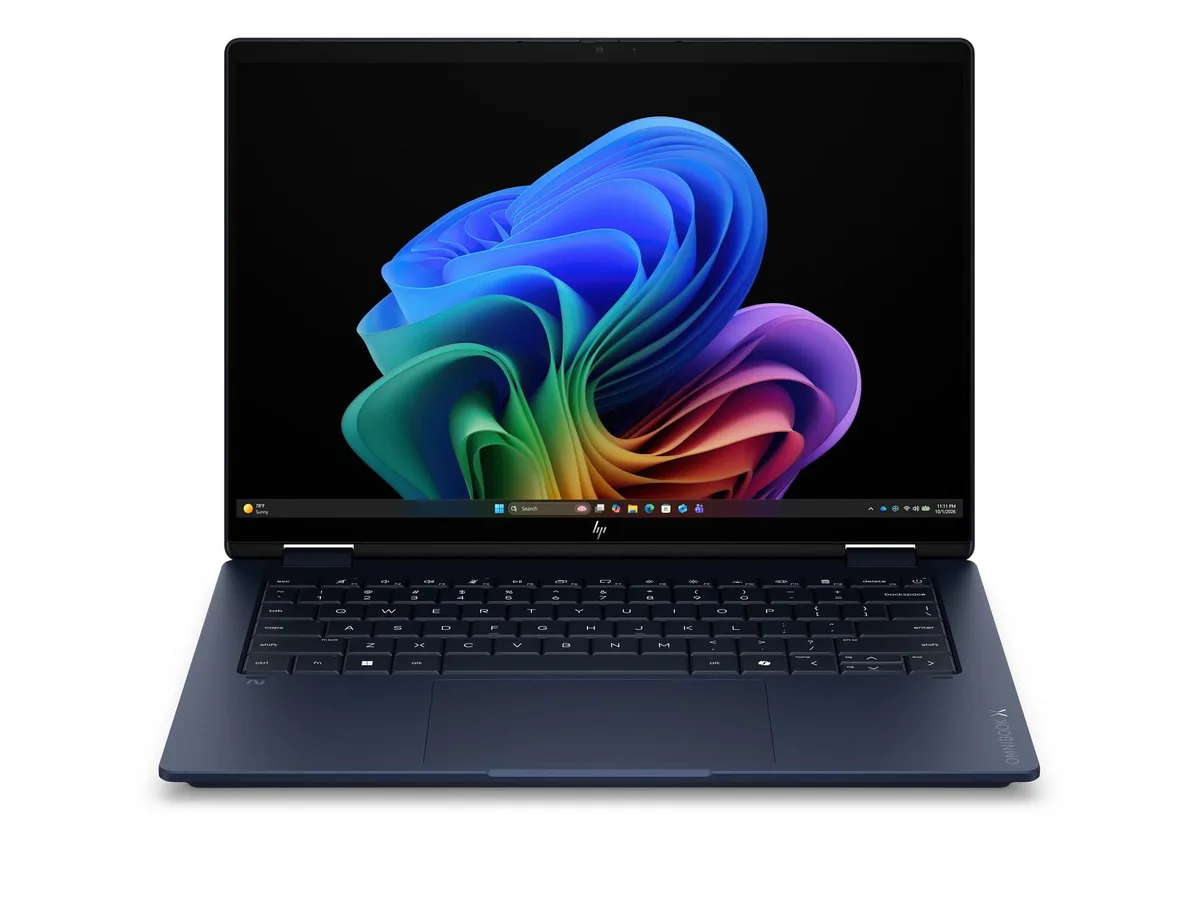 Silver 14 inch convertible laptop with edge-to-edge glass OLED touchscreen and included stylus pen