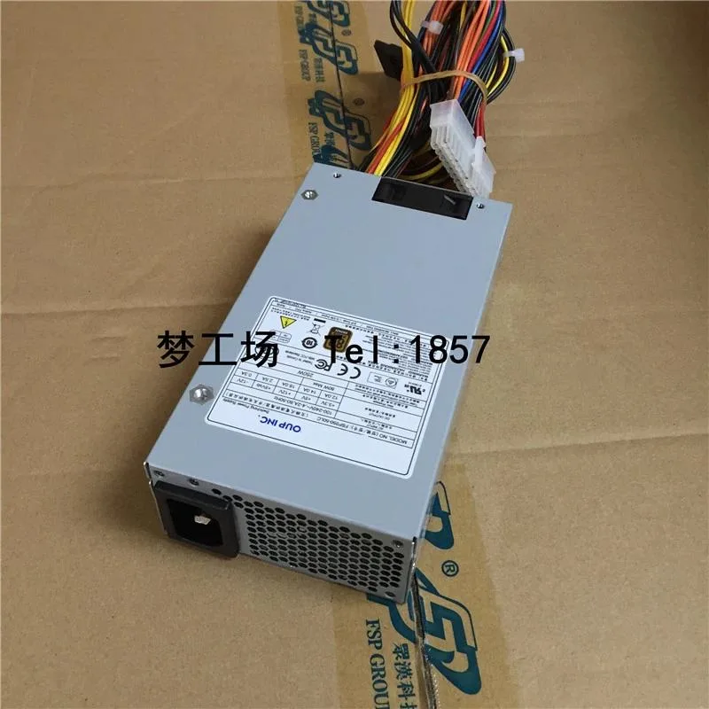 Compact silver 1U ATX power supply unit with rear fan grille and cable bundle