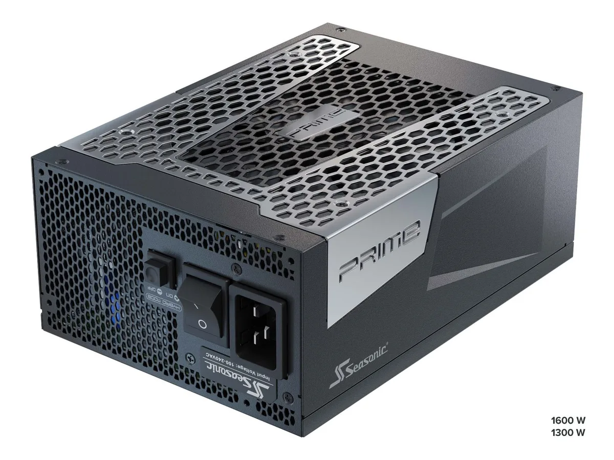 Black rectangular ATX power supply with modular cable ports and 135 mm fan grille