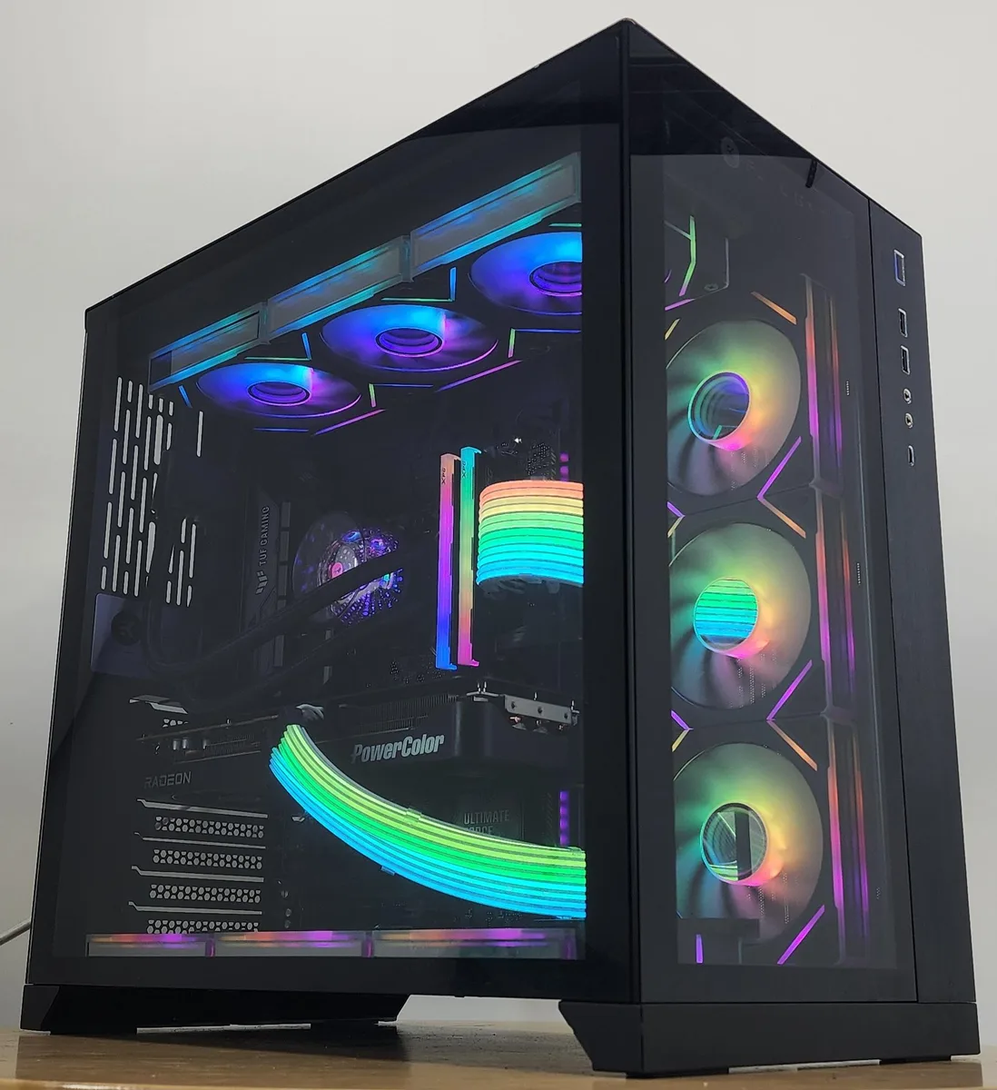 Black Lian Li O11 Dynamic ATX case with 360mm AIO RGB cooler visible through glass panel