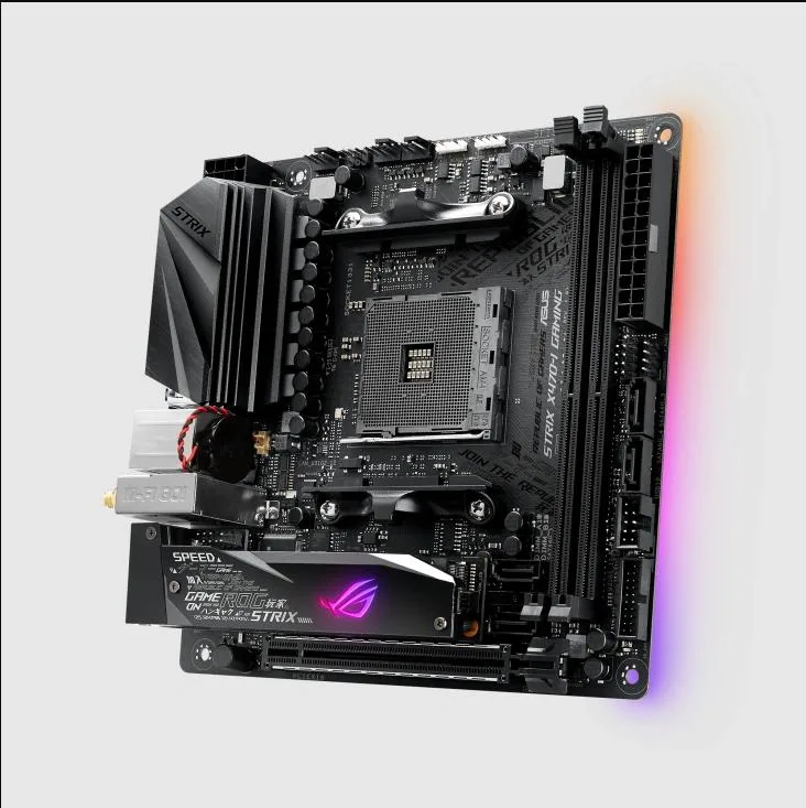 Small square Mini-ITX motherboard dark PCB with metallic heatsinks and rear I/O shield