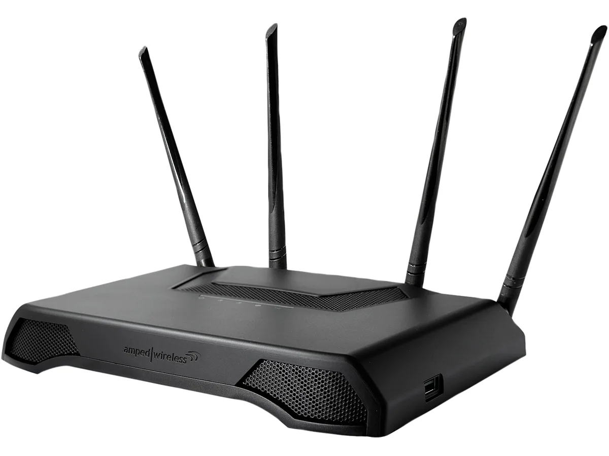 Black rectangular router with four detachable antennas standing upright
