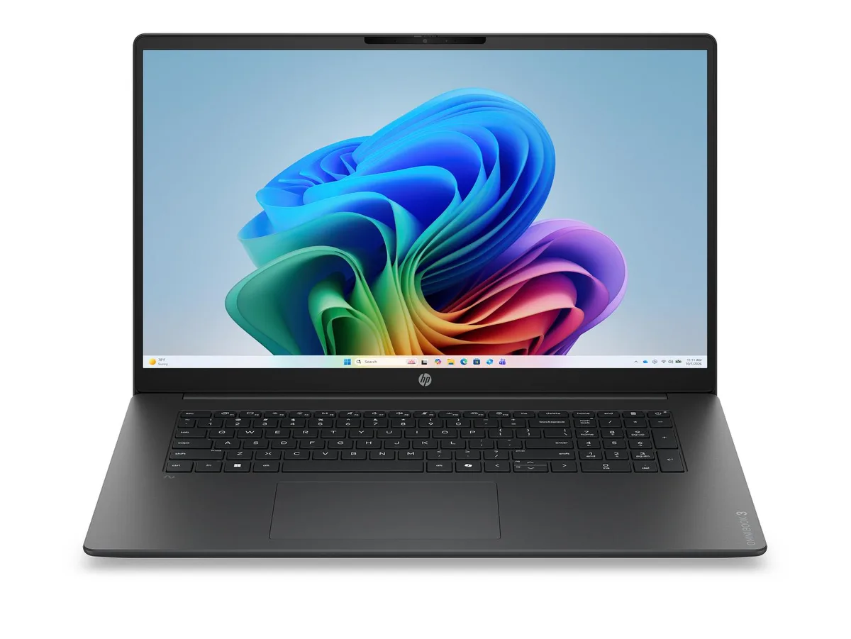Silver 17.3 inch laptop closed on plain background