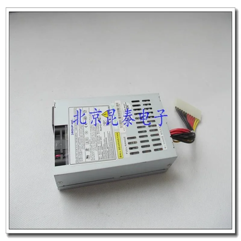 Compact silver ATX power supply unit with 12-pin connector visible