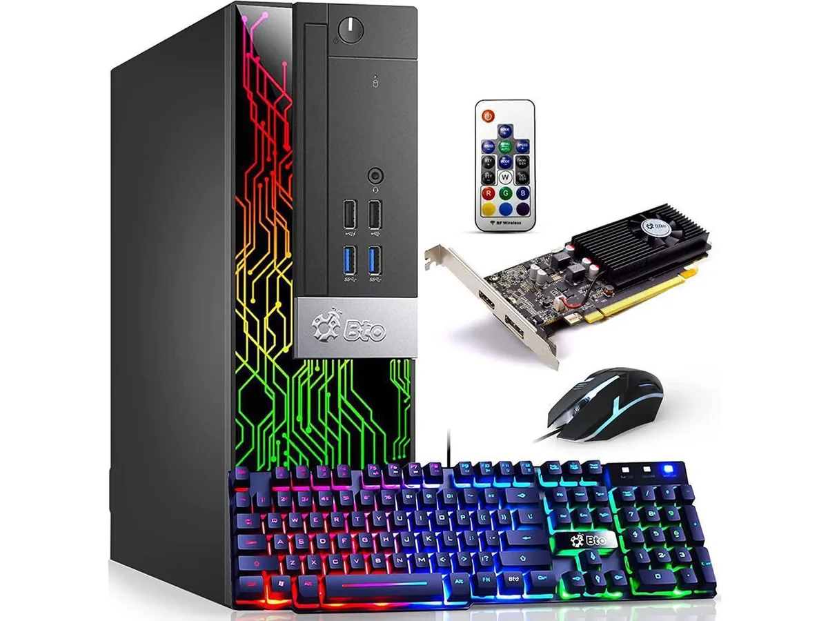 Black mid-tower gaming desktop with RGB lighting, keyboard and mouse
