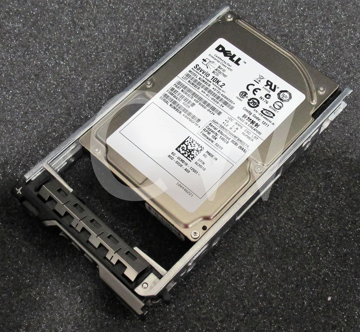 Small silver 2.5 inch SAS hard drive with green circuit board visible