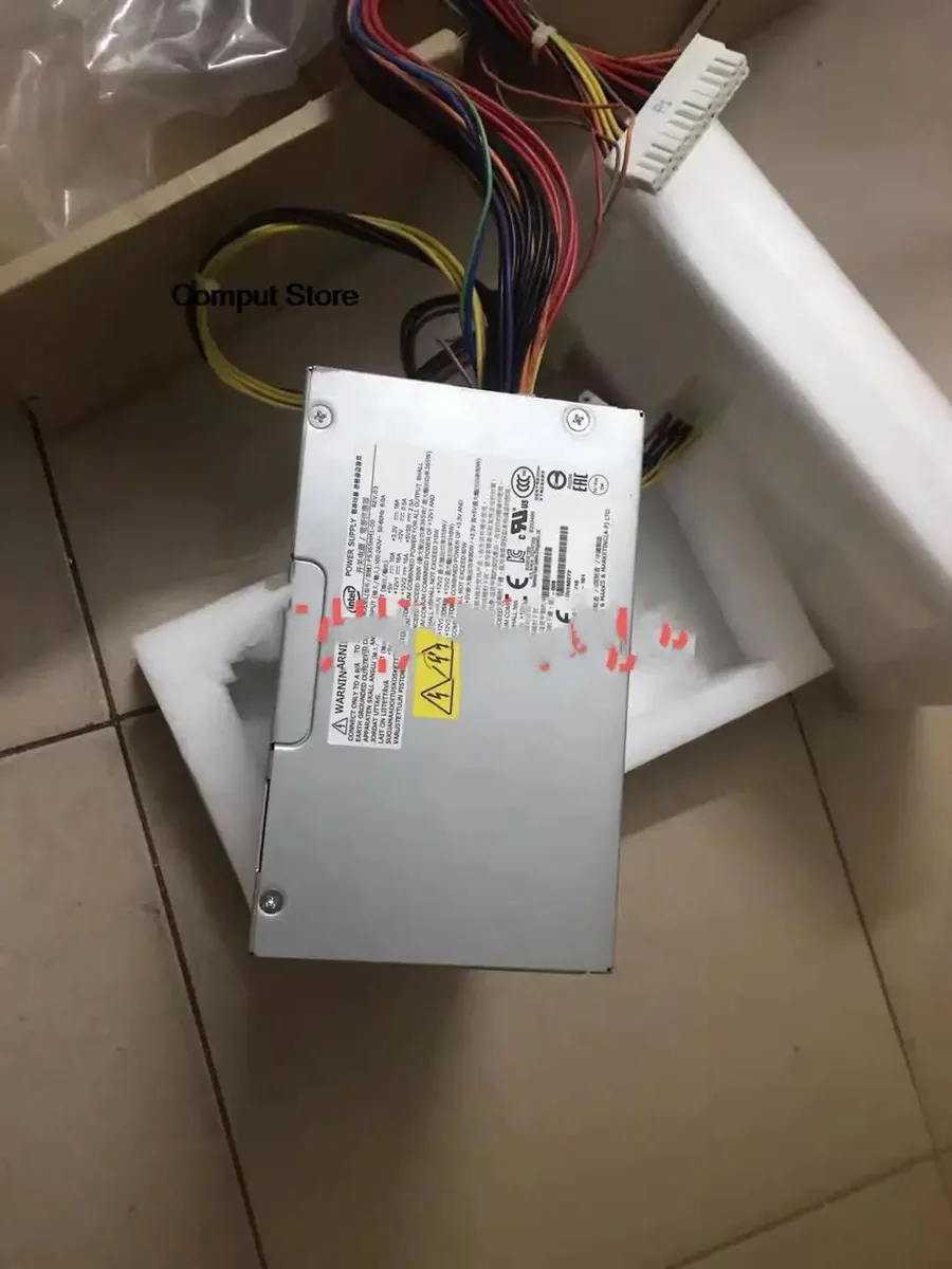 Standard ATX power supply unit in metal casing with fan grille and power socket