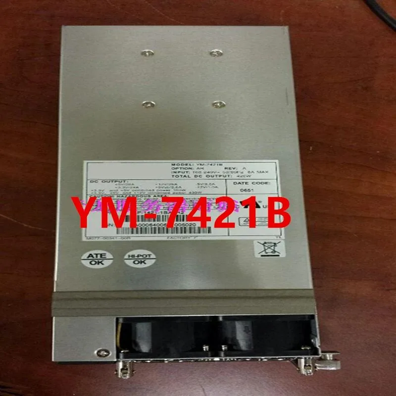 Rectangular silver ATX power supply unit with fan grille and cable bundle