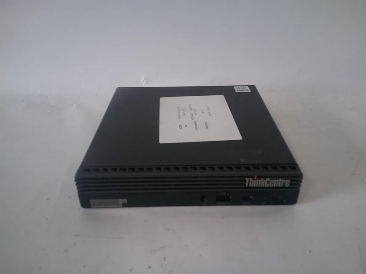 Tiny black desktop cube with small front screen