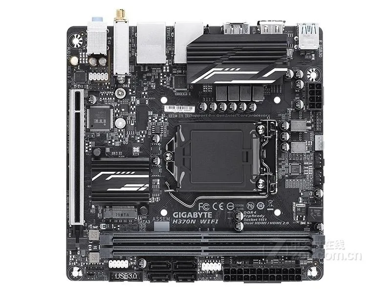 Green Mini-ITX motherboard with silver CPU socket, two black DDR4 slots, rear I/O shield, single PCIe x16 slot
