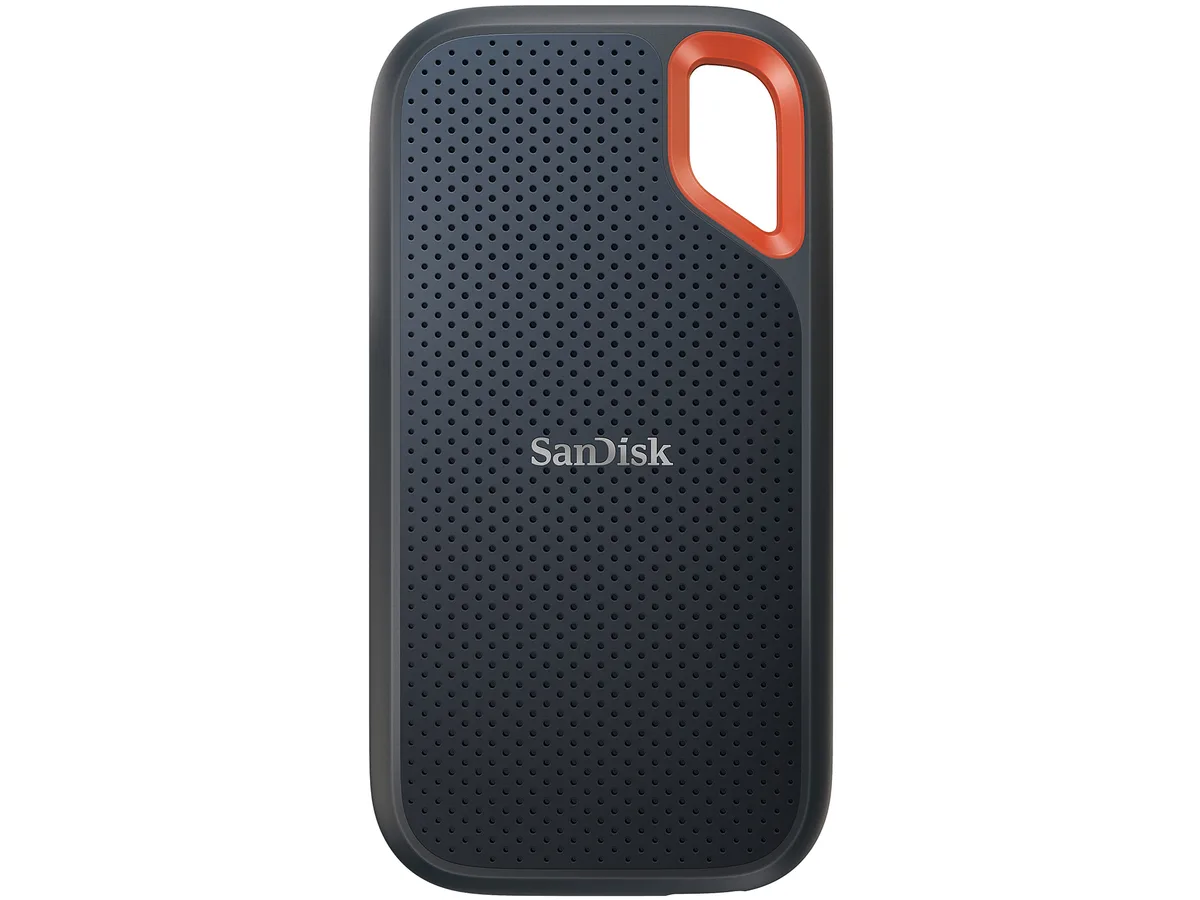 Black rectangular portable SSD with rounded edges, orange carabiner loop, USB-C port, 100.8 by 52.55 by 9.6 mm