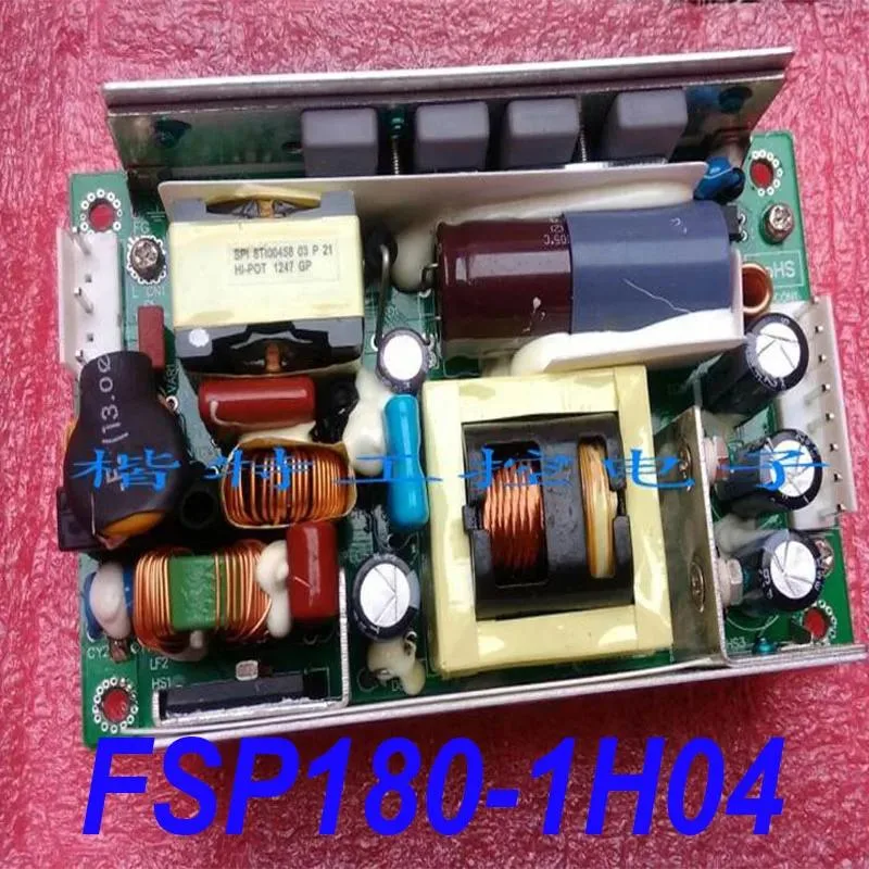 Rectangular metal ATX power supply unit with fan grille and cable connectors