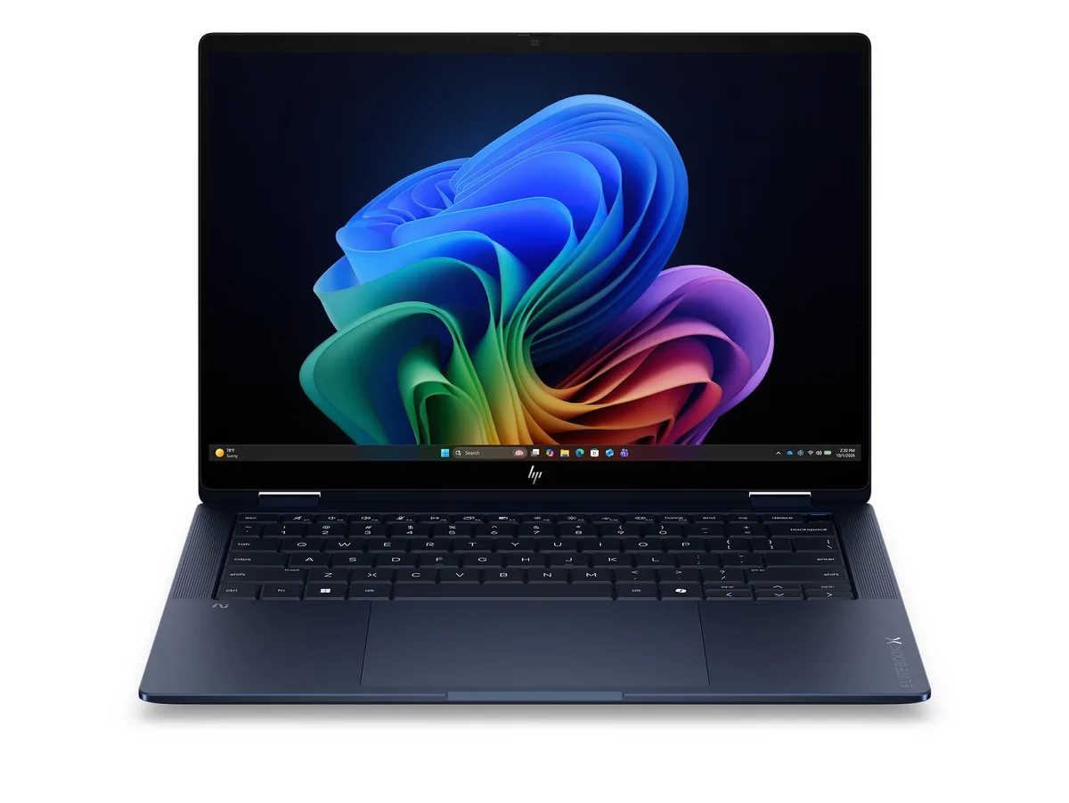 Silver 14 inch convertible laptop with 3K OLED touchscreen, thin profile