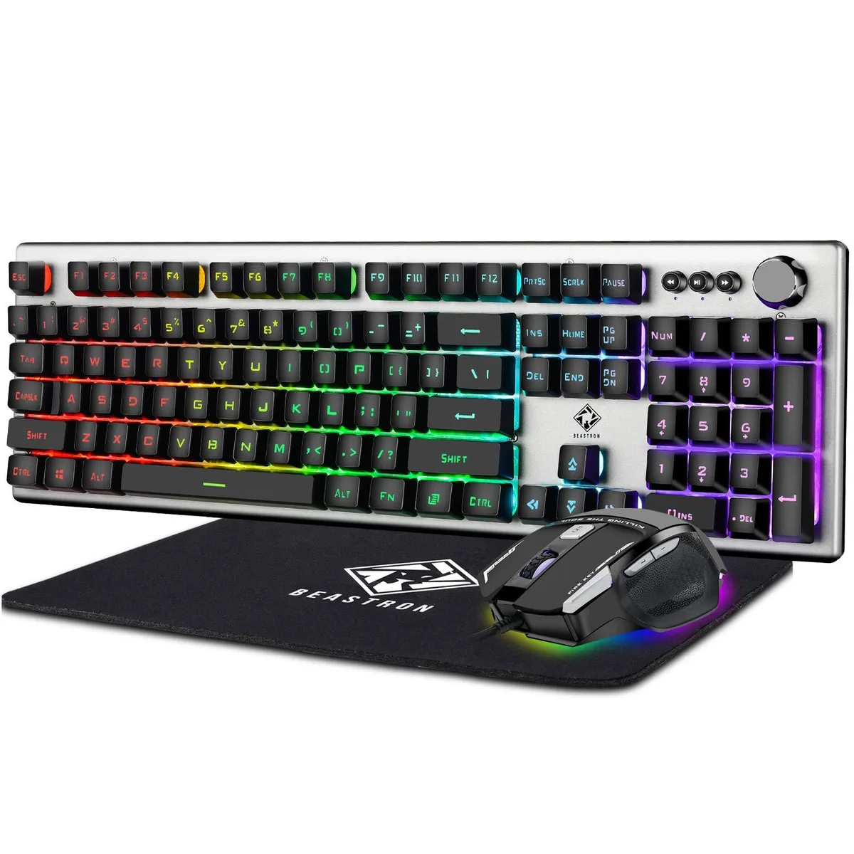 Silvery-white keyboard with volume knob, black mouse and pad, rainbow backlighting visible