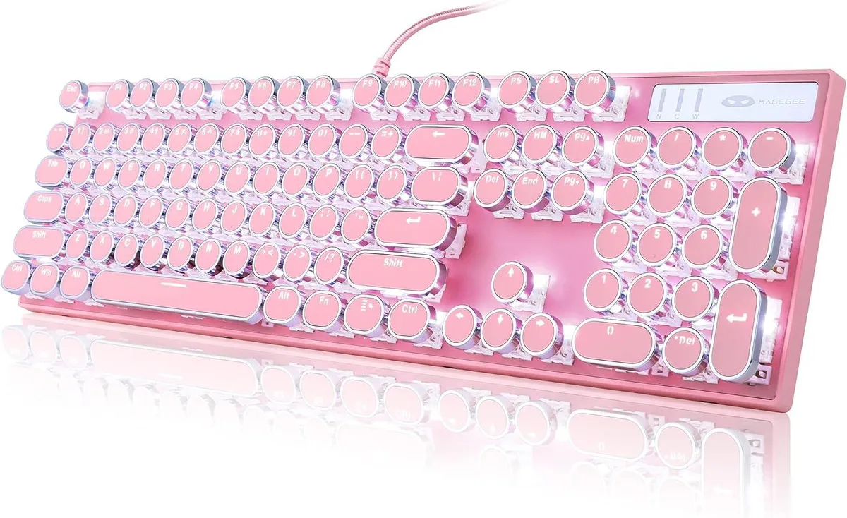 Pink typewriter-style mechanical keyboard with round keycaps and white backlighting